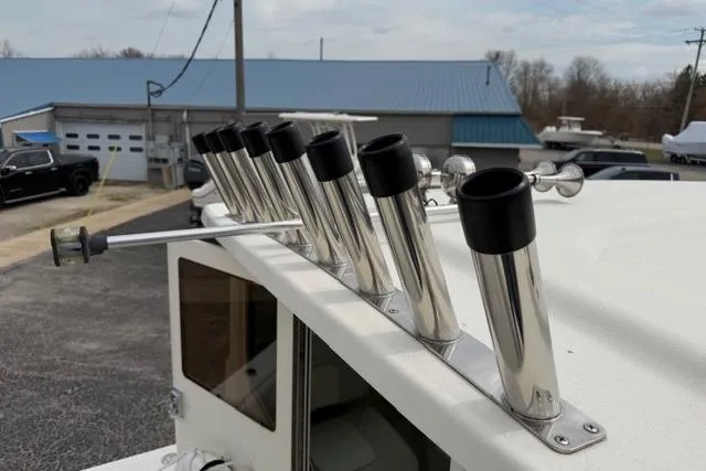 Slide: The Image of 2015 Parker 2520XLD boat with stainless steel rod holders on the roof. - 7