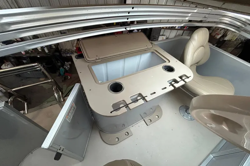 Slide: The Image of 2021 Sylvan Mirage Fish 820 CNF interior with seating and storage compartments. - 12
