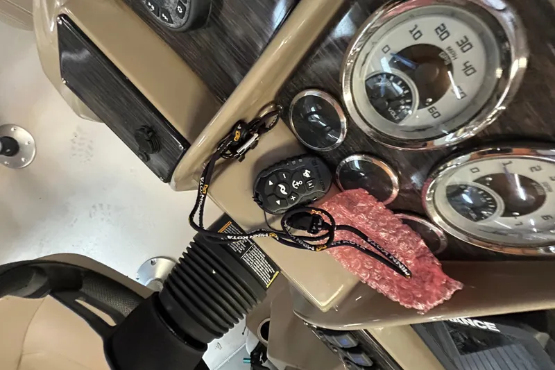 Slide: The Image of Dashboard of 2021 Sylvan Mirage Fish 820 CNF with gauges and controls. - 14