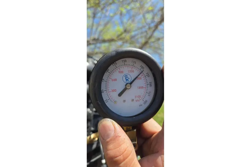 Slide: The Image of Close-up of a pressure gauge on a 2021 Sylvan Mirage Fish 820 CNF boat. - 15