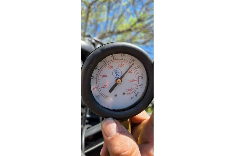 Slide: The Image of Close-up of a pressure gauge on a 2021 Sylvan Mirage Fish 820 CNF boat. - 17