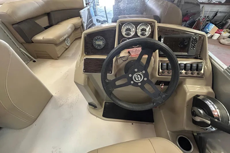 Slide: The Image of Interior view of 2021 Sylvan Mirage Fish 820 CNF boat dashboard and seating. - 8
