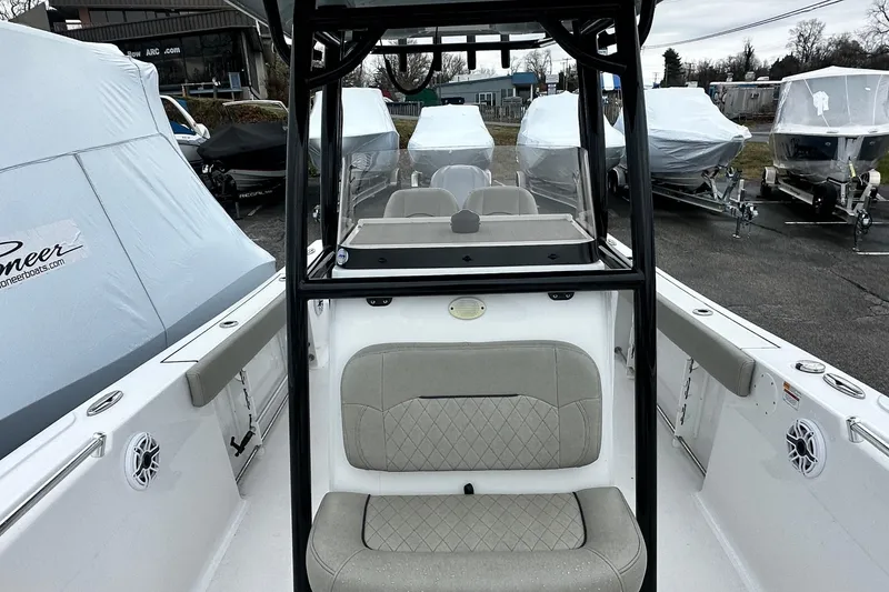 Slide: The Image of 2022 Sportsman Heritage 241 Center Console boat interior with steering wheel and control panel. - 10