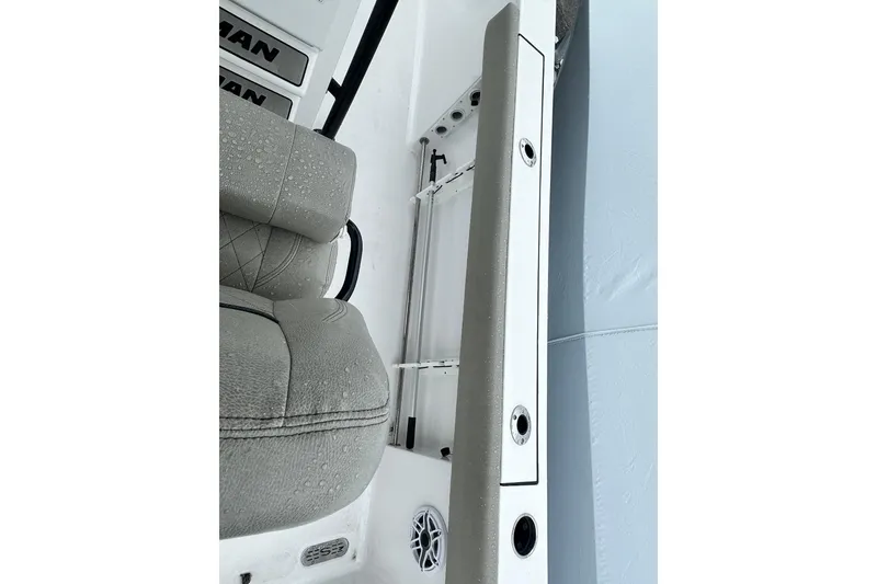 Slide: The Image of 2022 Sportsman Heritage 241 Center Console boat, interior view with seating and console. - 13