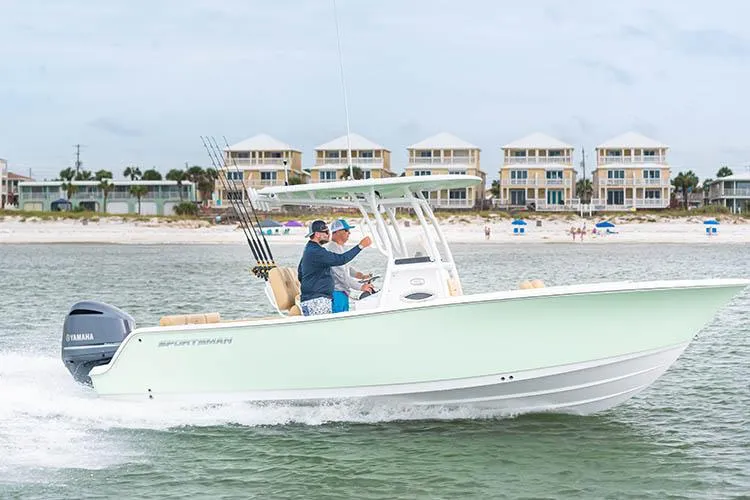 Slide: The Image of Interior view of 2022 Sportsman Heritage 241 Center Console boat, featuring cushioned seating and storage. - 16