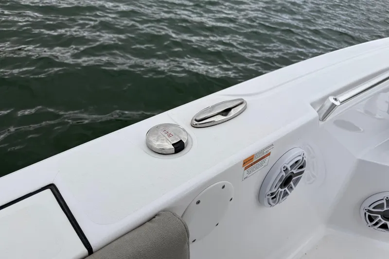 Slide: The Image of 2022 Sportsman Heritage 241 Center Console boat deck with speaker and water view. - 25