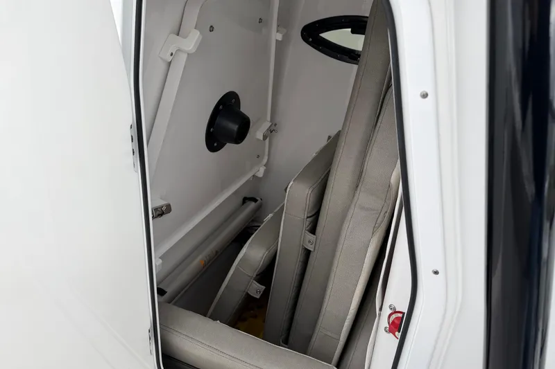 Slide: The Image of Interior view of 2022 Sportsman Heritage 241 Center Console boat storage compartment. - 26
