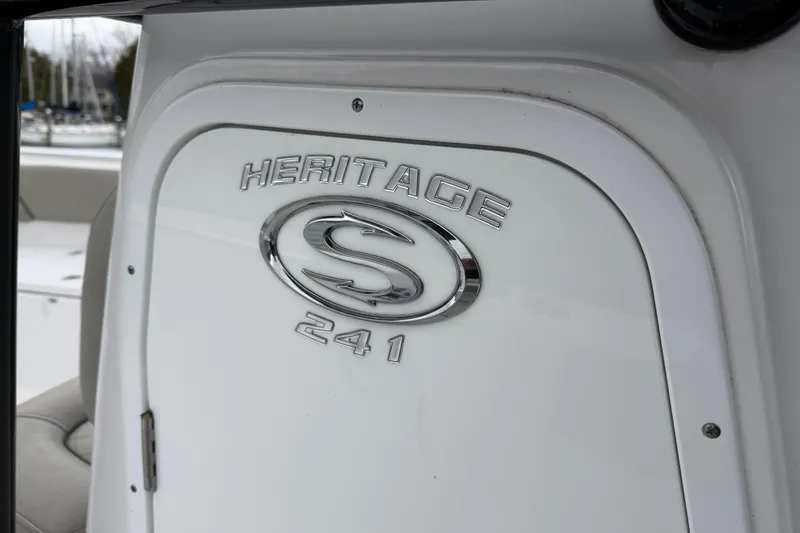 Slide: The Image of 2022 Sportsman Heritage 241 Center Console boat emblem detail. - 27