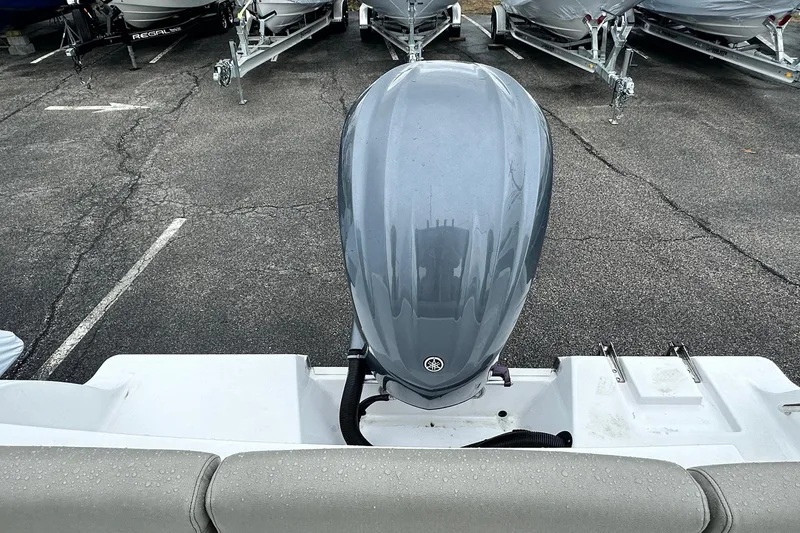 Slide: The Image of 2022 Sportsman Heritage 241 Center Console boat on trailer, parked outdoors. - 3