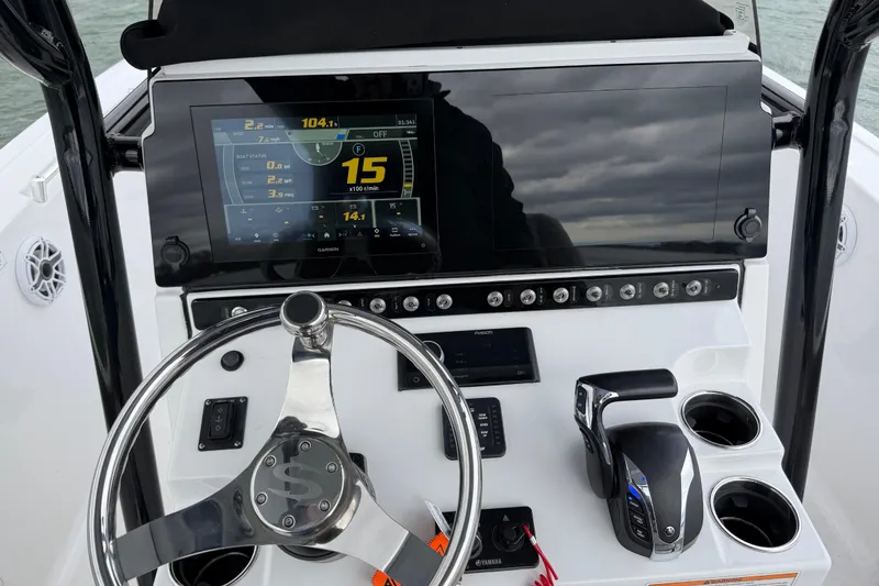 Slide: The Image of 2022 Sportsman Heritage 241 Center Console dashboard with steering wheel and digital display. - 33