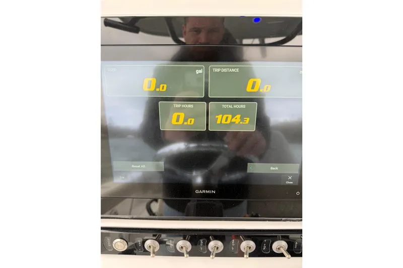 Slide: The Image of Garmin display on 2022 Sportsman Heritage 241 Center Console showing trip data and total hours. - 37