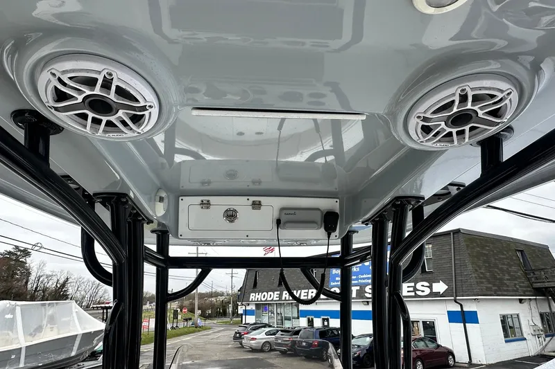 Slide: The Image of 2022 Sportsman Heritage 241 Center Console boat on trailer, parked outdoors. - 4