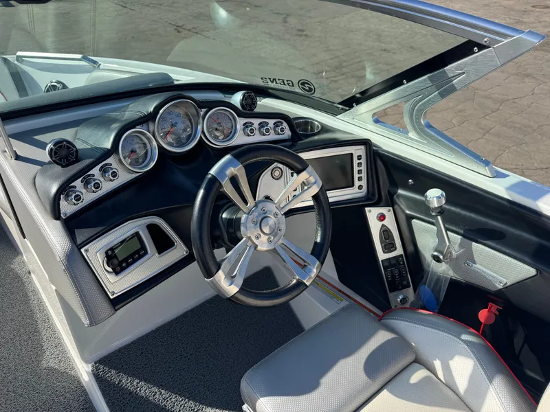 Slide: The Image of Interior view of 2016 MasterCraft X30 boat cockpit with controls. - 12