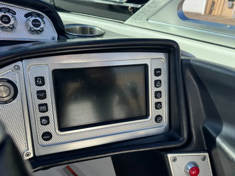 Slide: The Image of Dashboard of a 2016 MasterCraft X30 boat with display screen. - 14