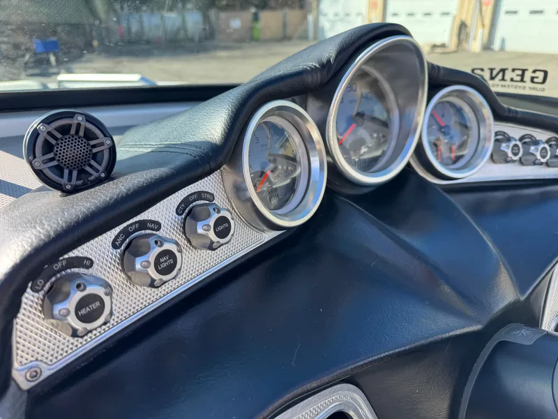 Slide: The Image of Dashboard of a 2016 MasterCraft X30 boat with gauges. - 15