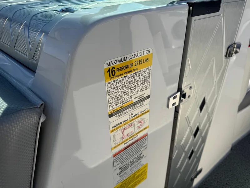 Slide: The Image of 2016 MasterCraft X30 boat capacity label, 16 persons or 2219 lbs. - 19