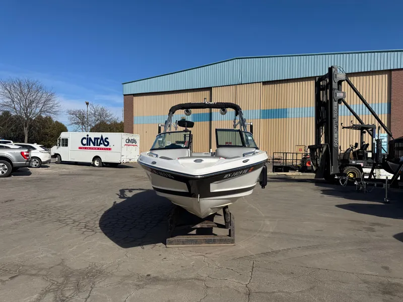 Slide: The Image of 2016 MasterCraft X30 boat parked in front of warehouse. - 2