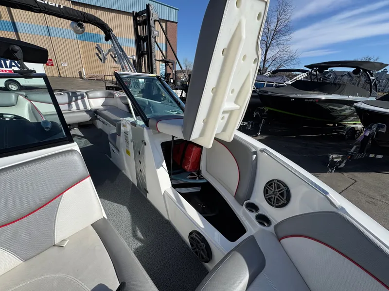 Slide: The Image of Interior of a 2016 MasterCraft X30 boat with open storage compartments. - 24