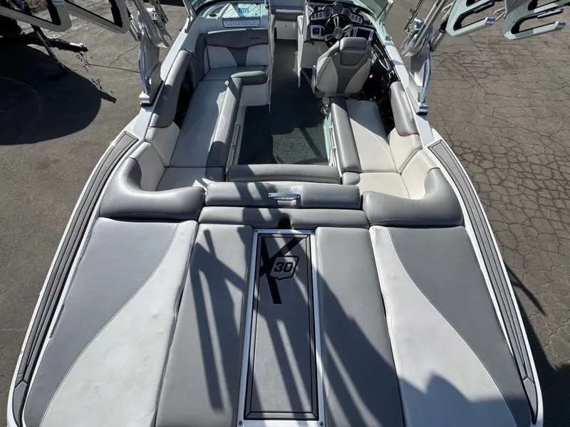 Slide: The Image of Interior of a 2016 MasterCraft X30 boat, gray upholstery. - 25