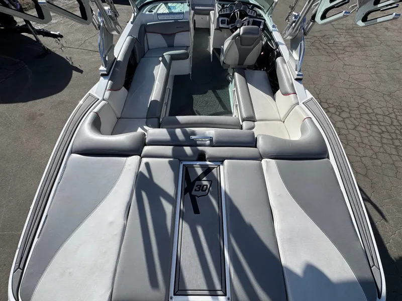 Slide: The Image of Interior of a 2016 MasterCraft X30 boat, gray upholstery. - 26
