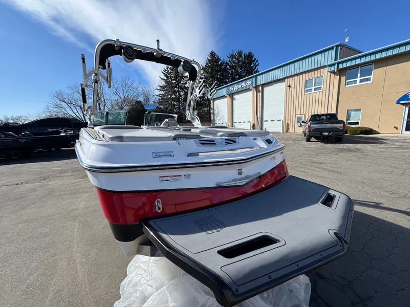 Slide: The Image of 2016 MasterCraft X30 boat parked outside building. - 3