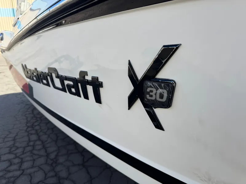 Slide: The Image of Close-up of MasterCraft X30 boat logo, model year 2016. - 33