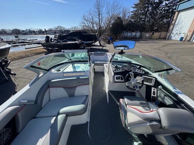 Slide: The Image of Interior of a 2016 MasterCraft X30 boat at the dock. - 6