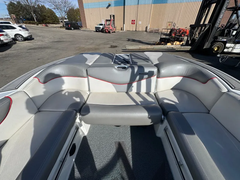 Slide: The Image of Interior of a 2016 MasterCraft X30 boat with gray and white seating. - 7