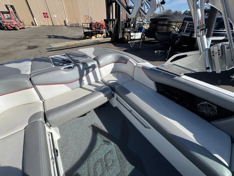Slide: The Image of Interior of a 2016 MasterCraft X30 boat with gray and white seating. - 8