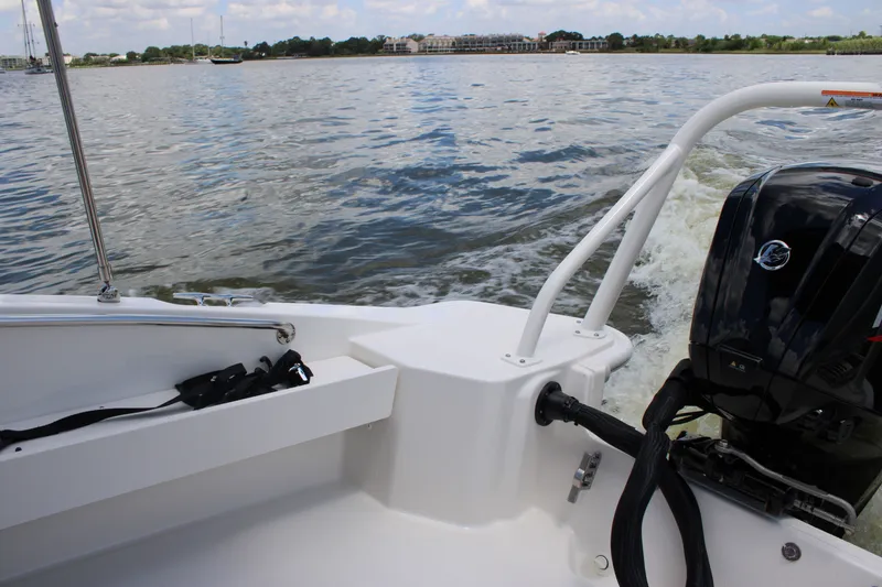 Slide: The Image of The image shows the stern of a Boston Whaler 160 Super Sport boat on the water. - 31