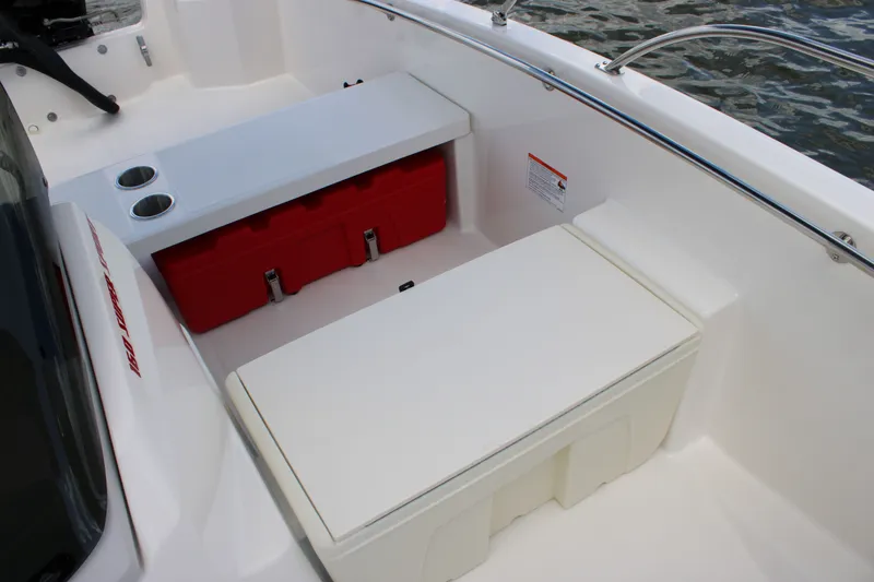 Slide: The Image of The image shows the cockpit of a Boston Whaler 160 Super Sport with white seats and red storage compartments. - 15
