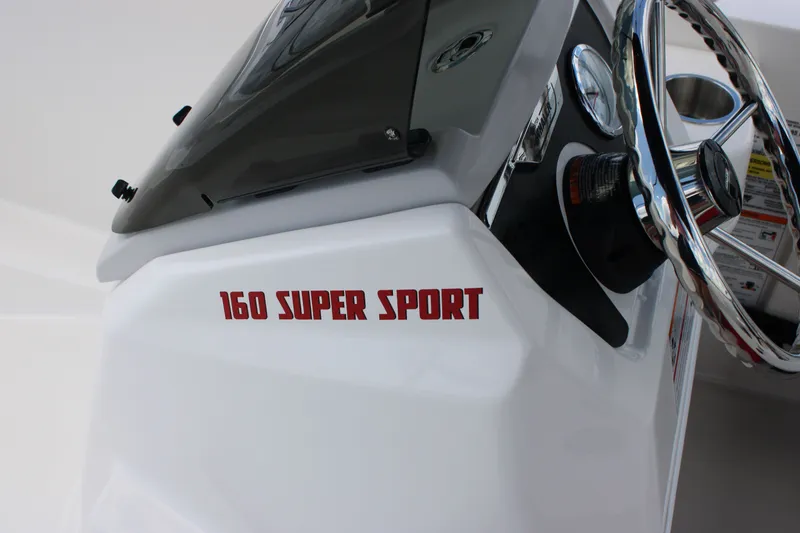 Slide: The Image of Close-up of the helm of a 2026 Boston Whaler 160 Super Sport. - 22