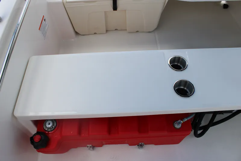 Slide: The Image of Interior of a Boston Whaler 160 Super Sport with white bench seat and red tank. - 25
