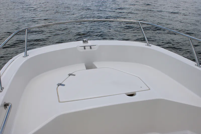 Slide: The Image of The image shows the bow of a 2026 Boston Whaler 160 Super Sport with a white deck and stainless steel railing. - 23