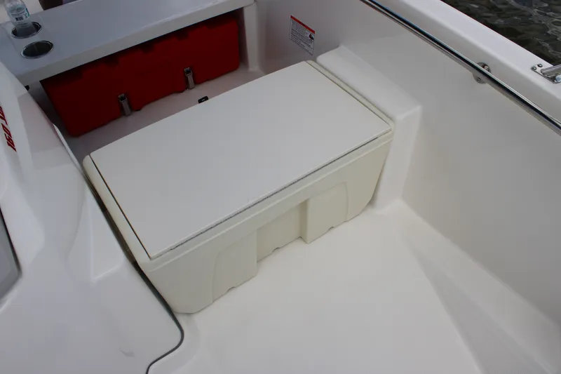 Slide: The Image of The 2026 Boston Whaler 160 Super Sport features a white bench seat with storage underneath. - 19