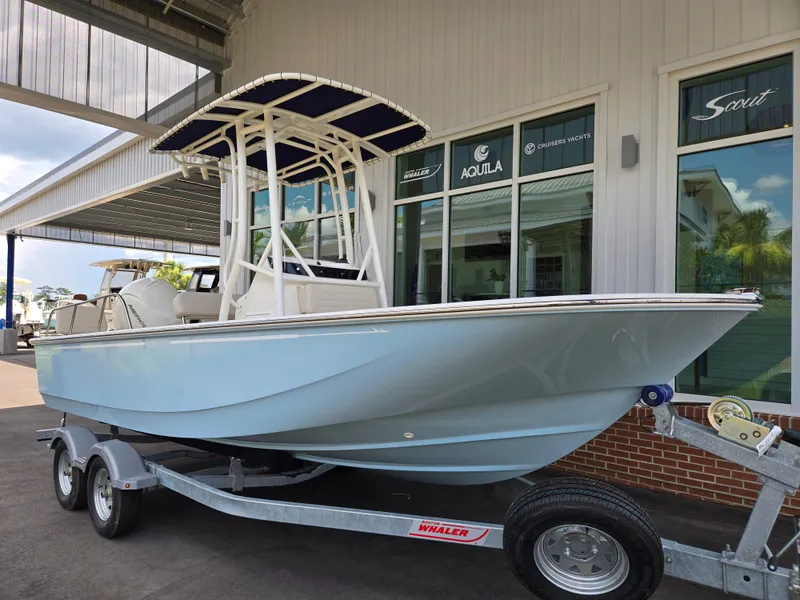 Slide: The Image of A 2026 Boston Whaler 190 Montauk on a trailer outside a building. - 13