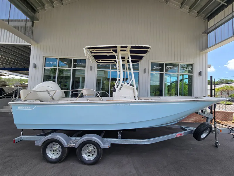 Slide: The Image of A 2026 Boston Whaler 190 Montauk boat on a trailer in a showroom. - 14