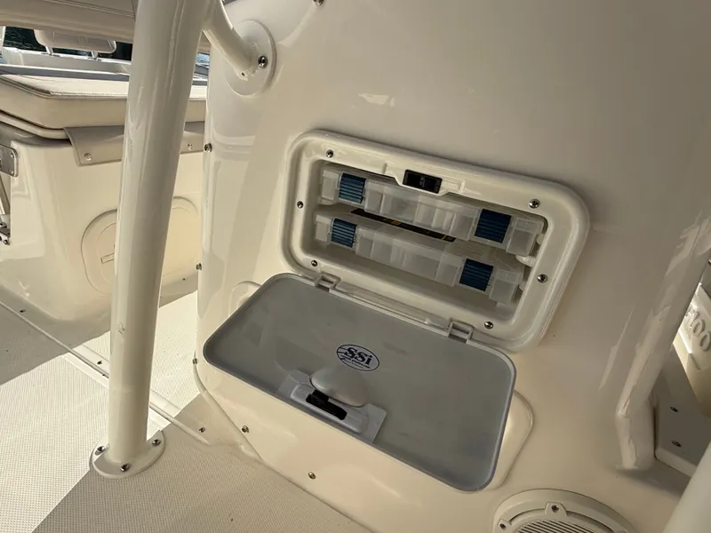 Slide: The Image of The image shows the interior of a Boston Whaler 190 Montauk boat with storage and seating. - 14