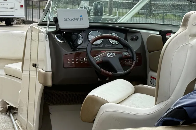 Slide: The Image of Interior of a 2007 Sea Ray 210 Dual Console boat with Garmin navigation system. - 10