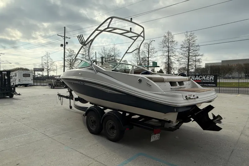 Slide: The Image of 2007 Sea Ray 210 Dual Console boat on trailer in outdoor setting. - 5