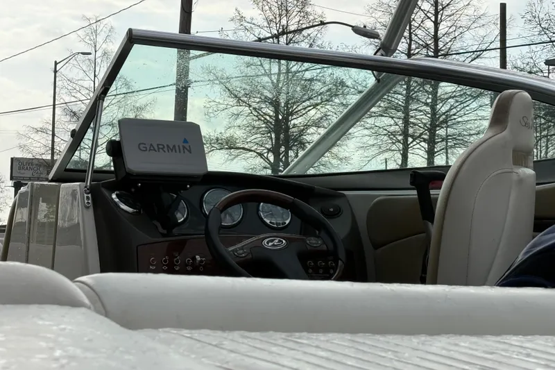 Slide: The Image of Interior of a 2007 Sea Ray 210 Dual Console boat with Garmin navigation system. - 9