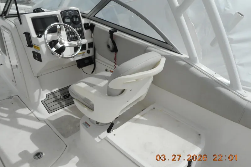 Slide: The Image of Interior view of 2021 Sea Fox 226 Traveler boat cockpit with steering wheel and seat. - 11