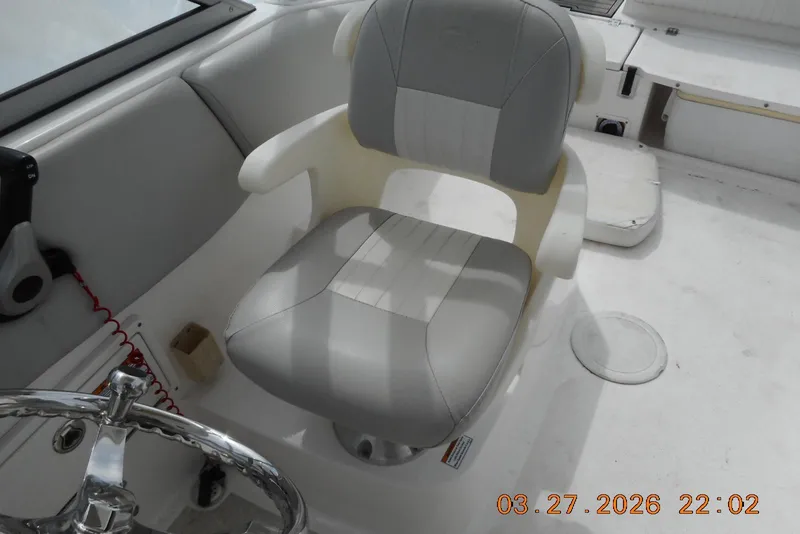 Slide: The Image of Captain's chair on 2021 Sea Fox 226 Traveler boat, featuring a sleek design and comfortable seating. - 12