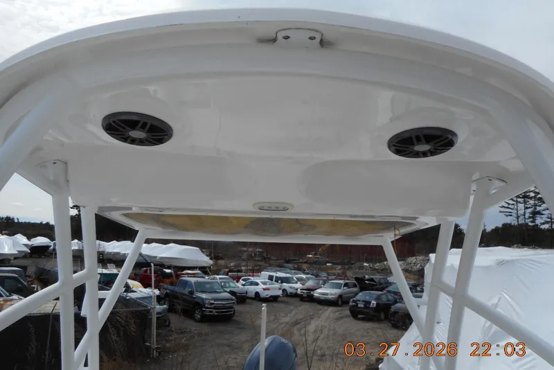 Slide: The Image of 2021 Sea Fox 226 Traveler boat canopy with speakers, parked in a lot. - 15