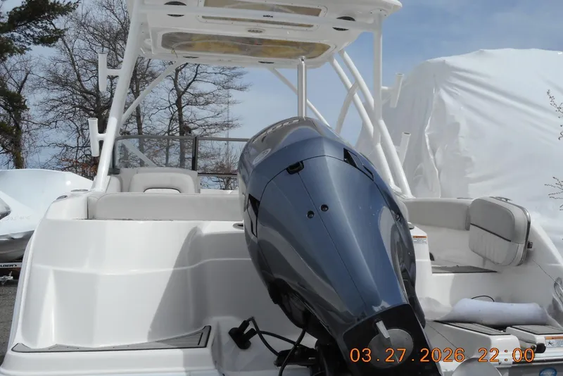 Slide: The Image of 2021 Sea Fox 226 Traveler boat with outboard motor, parked outdoors. - 4