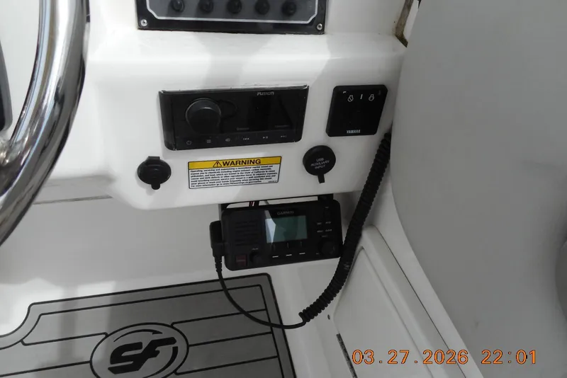 Slide: The Image of 2021 Sea Fox 226 Traveler dashboard with controls and warning label. - 8