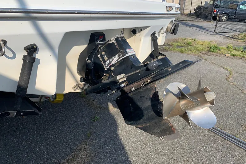 Slide: The Image of Rear view of a 2004 Formula 260 Bowrider boat with a Mercury outdrive. - 10