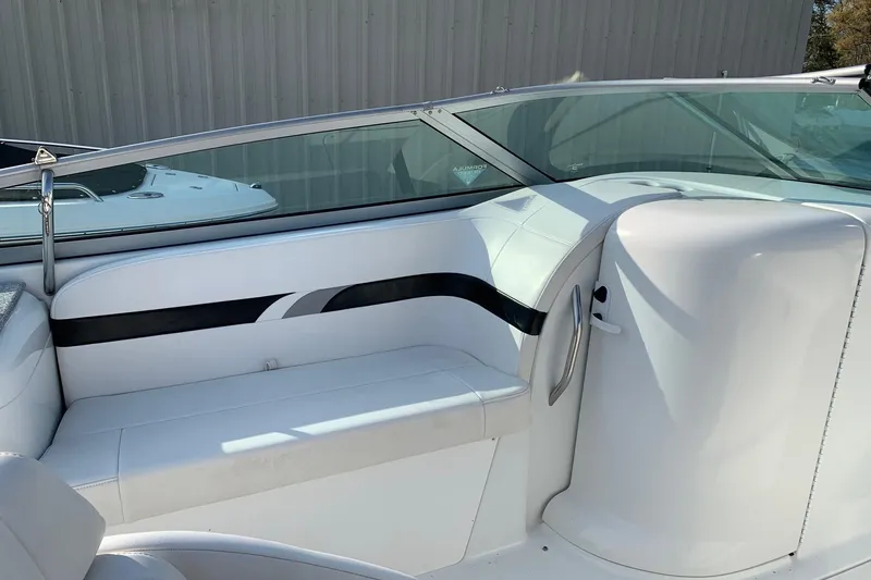 Slide: The Image of 2004 Formula 260 Bowrider interior with white seating and sleek design. - 5