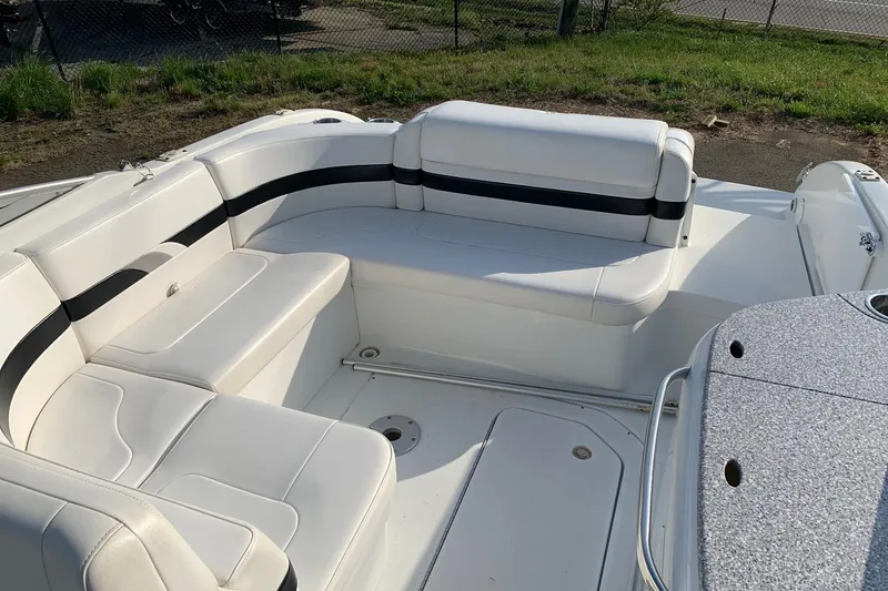 Slide: The Image of 2004 Formula 260 Bowrider boat interior with white seating and black accents. - 6