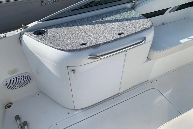 Slide: The Image of 2004 Formula 260 Bowrider interior with seating and storage area. - 8